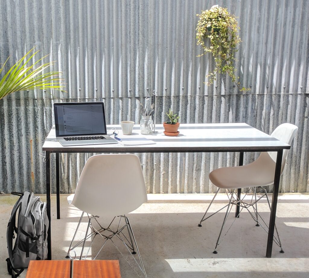 Laptop and desk in summer