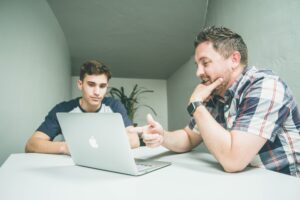student and staff member in writing center